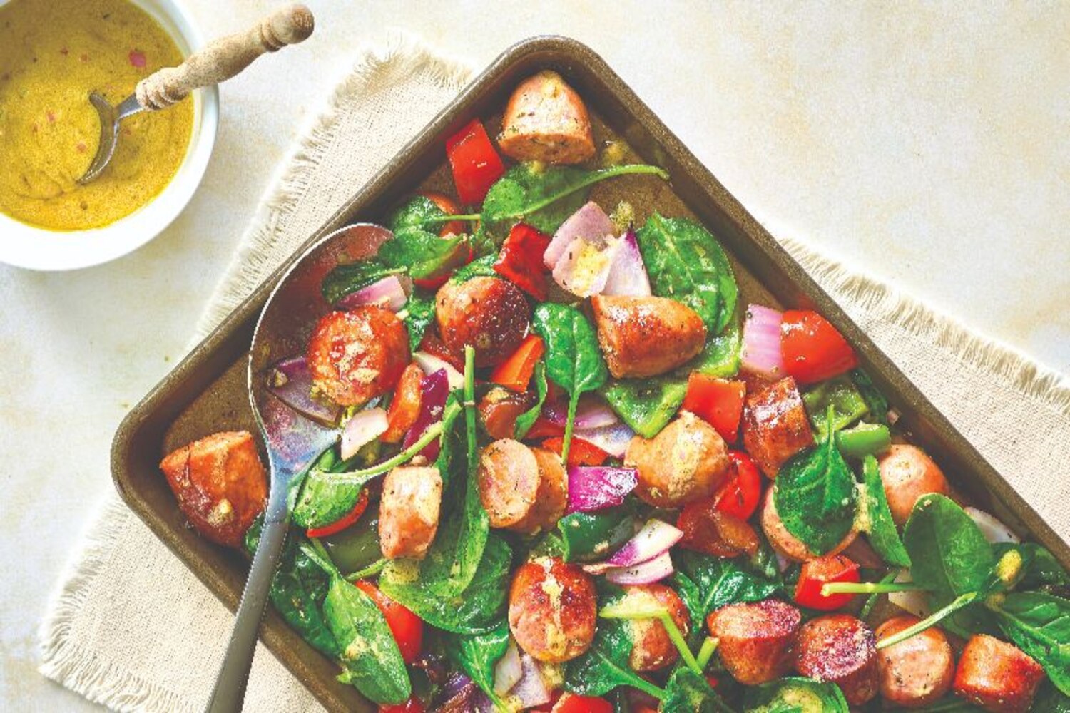Sheetpan Sausages & Spinach With Dijon Vinaigrette | Canadian Living