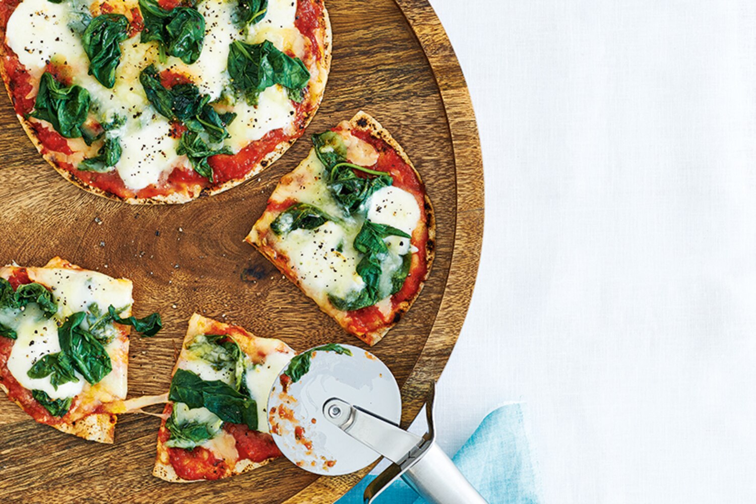 Double Mozzarella and Spinach Pita Pizzas Canadian Living