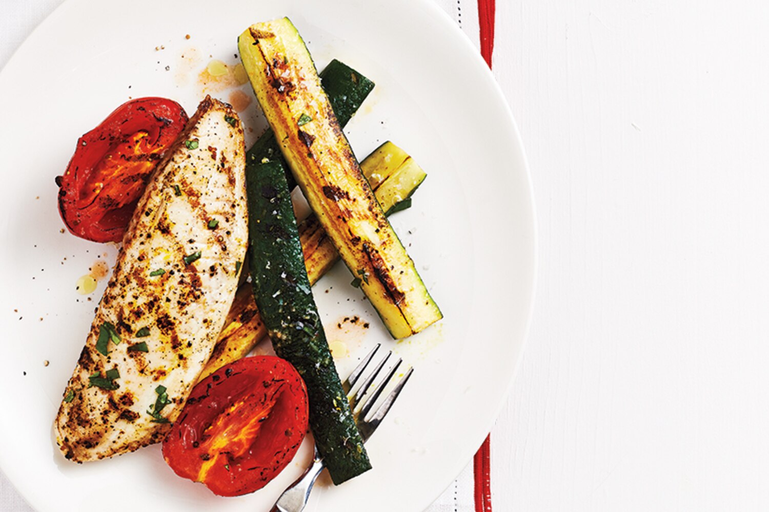 Lemon-Basil Tilapia with Charred Tomatoes and Zucchini Wedges | Canadian Living
