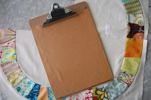 Clipboard with garnet sandpaper.