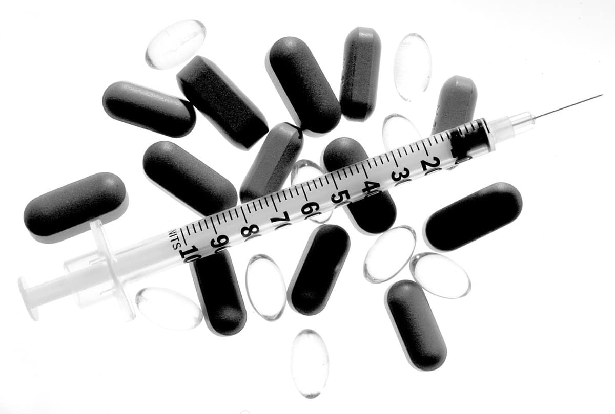 Pharmacy background on a black table. Tablets on a black background. Pills. Medicine and healthy. Close up of capsules. Differend kind of pills