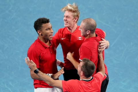 Felix Agar-Aliassim (right) of Canada and his team attend the trophy ceremony after defeating Roberto Bautista of Spain in their last men's singles match of the 2022 ATP Cup match between Spain and Canada in Sydney on January 9, 2022.