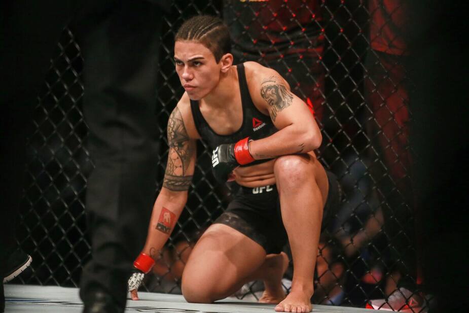 Jessica Andrade of Brazil reacts as she competes against Zhang Weili (L) of China (not pictured) in their UFC mixed martial arts (MMA) bout in Shenzhen, Guangdong province, on August 31, 2019. (Photo by STR / AFP) / China OUT