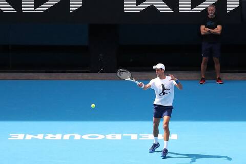 Djokovic trains at Australian Open, participation still pending