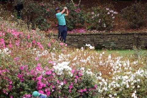 Nothing could stop Tiger Woods, who played superbly in the second round on Friday. We see him hitting his ball at the 13th tee.