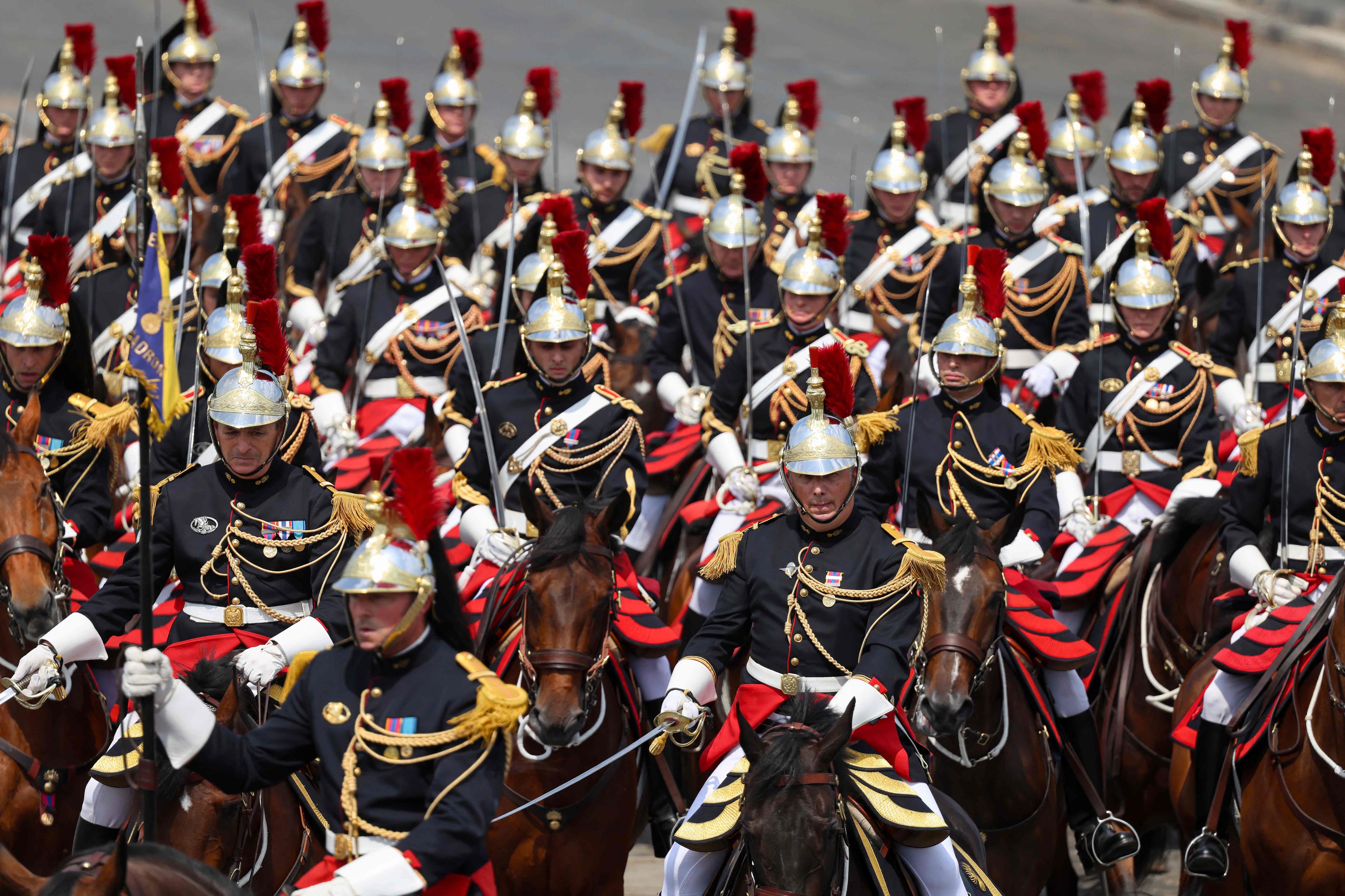 The Republican Guard on horseback parades during the traditional Bastille Day military parade on the Avenue des Champs-&Eacute;lys&eacute;es in Paris, July 14, 2026.
