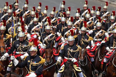 The Republican Guard on horseback parades during the traditional Bastille Day military parade on the Avenue des Champs-Élysées in Paris, July 14, 2026.