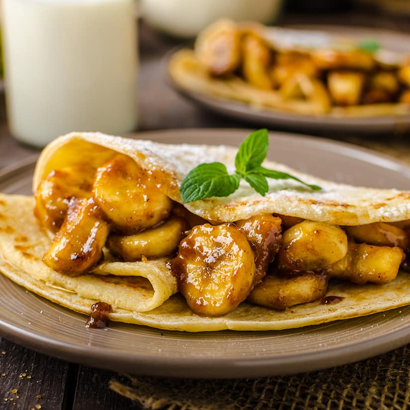 Crêpes de blé entier fourrées de bananes au rhum | Coup de pouce