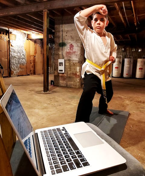 Yan, 10, has had to train in karate in the basement of the building where he lives since the new sanctions were announced.