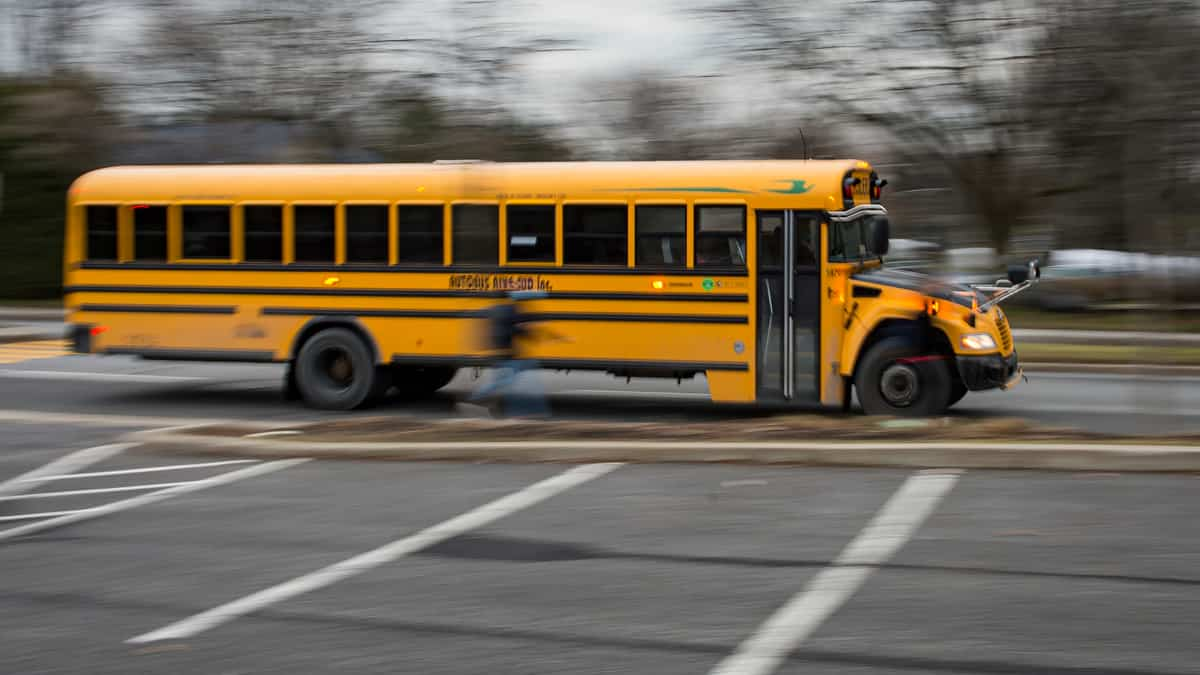 A driver is accused of setting fire to a bus with children on board