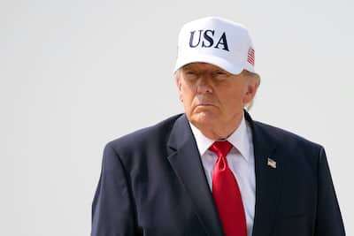U.S. President Donald Trump walks onto Air Force One before leaving Bismarck Municipal Airport, July 1, 2026.
