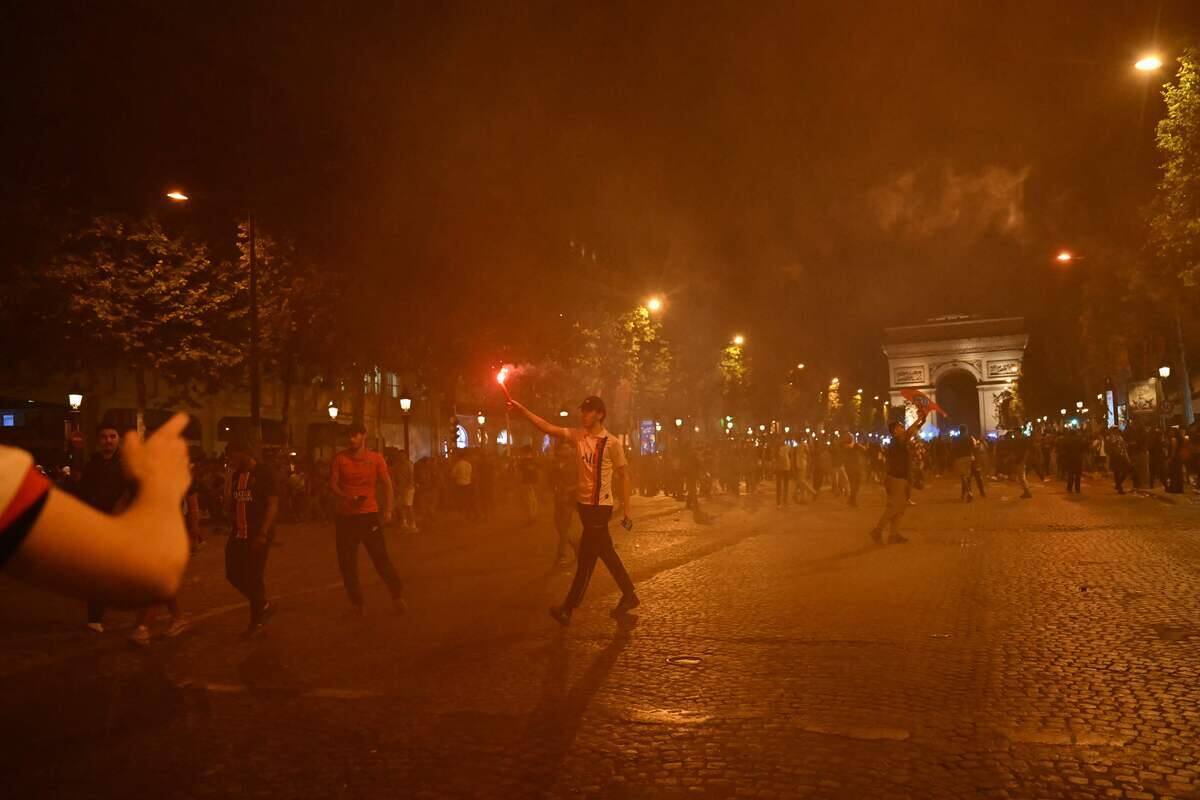 PSG Fans Celebrating on Champs-Élysées