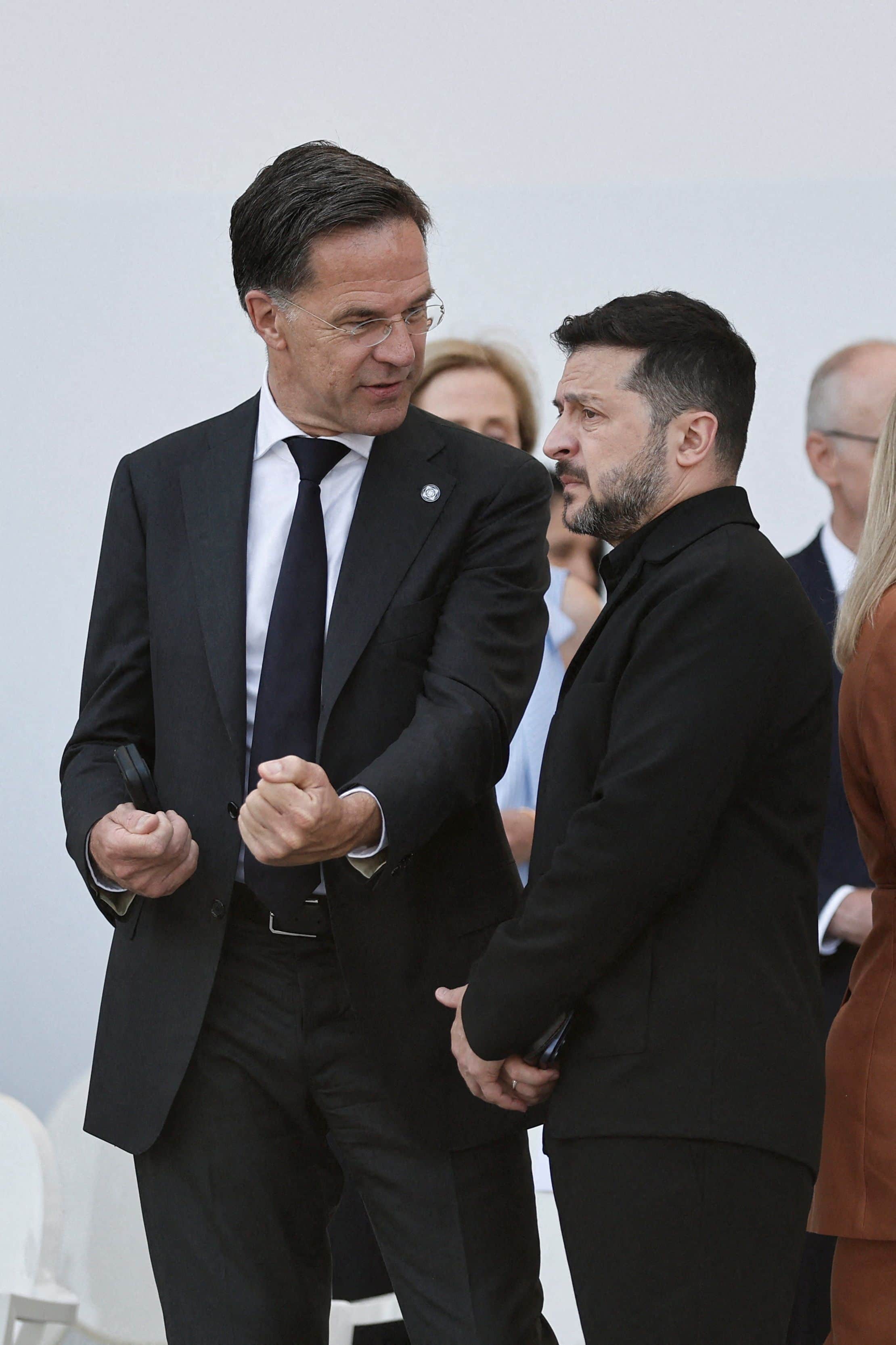 NATO Secretary General Mark Rutte speaks with Ukrainian President Volodymyr Zelensky at Place de la Concorde during the annual Bastille Day military parade in Paris, July 14, 2026.