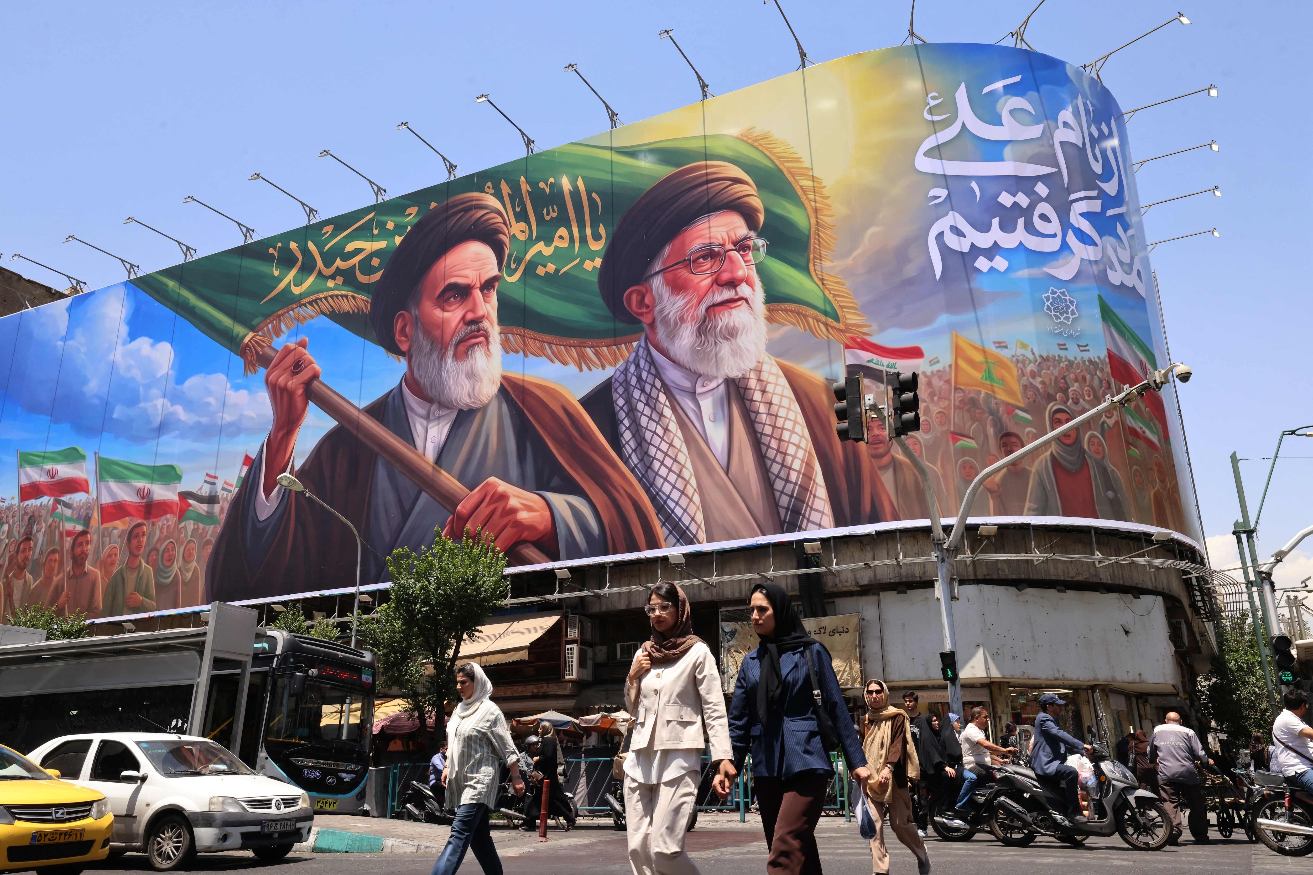 Hostilities between Iran and Israel suspended, threats persist