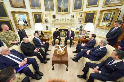 Ukrainian President Volodymyr Zelensky speaking with US President Donald Trump during their meeting in Washington, DC