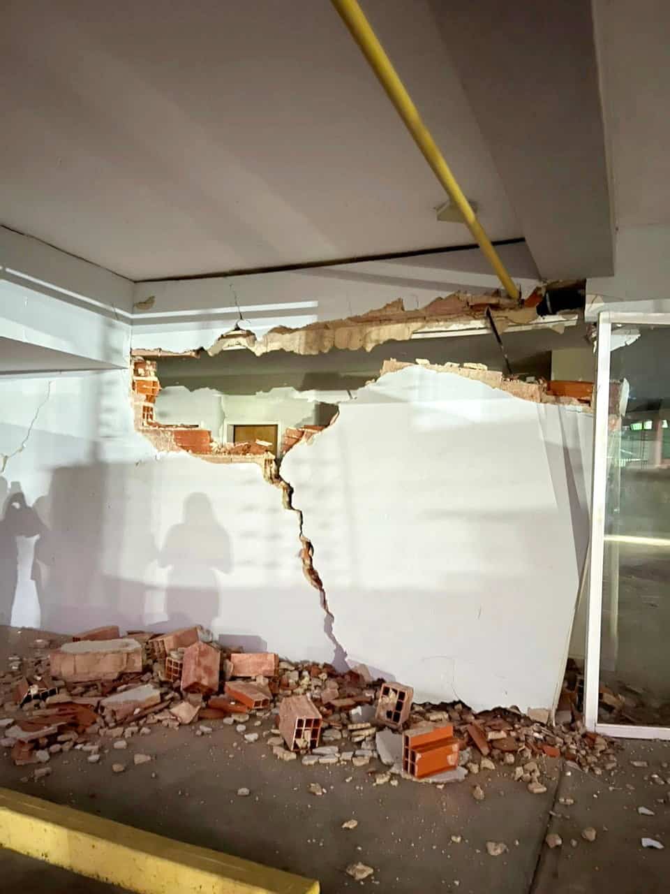 Sections of walls in Carlos Burgues' girlfriend's building were demolished by the tremors.