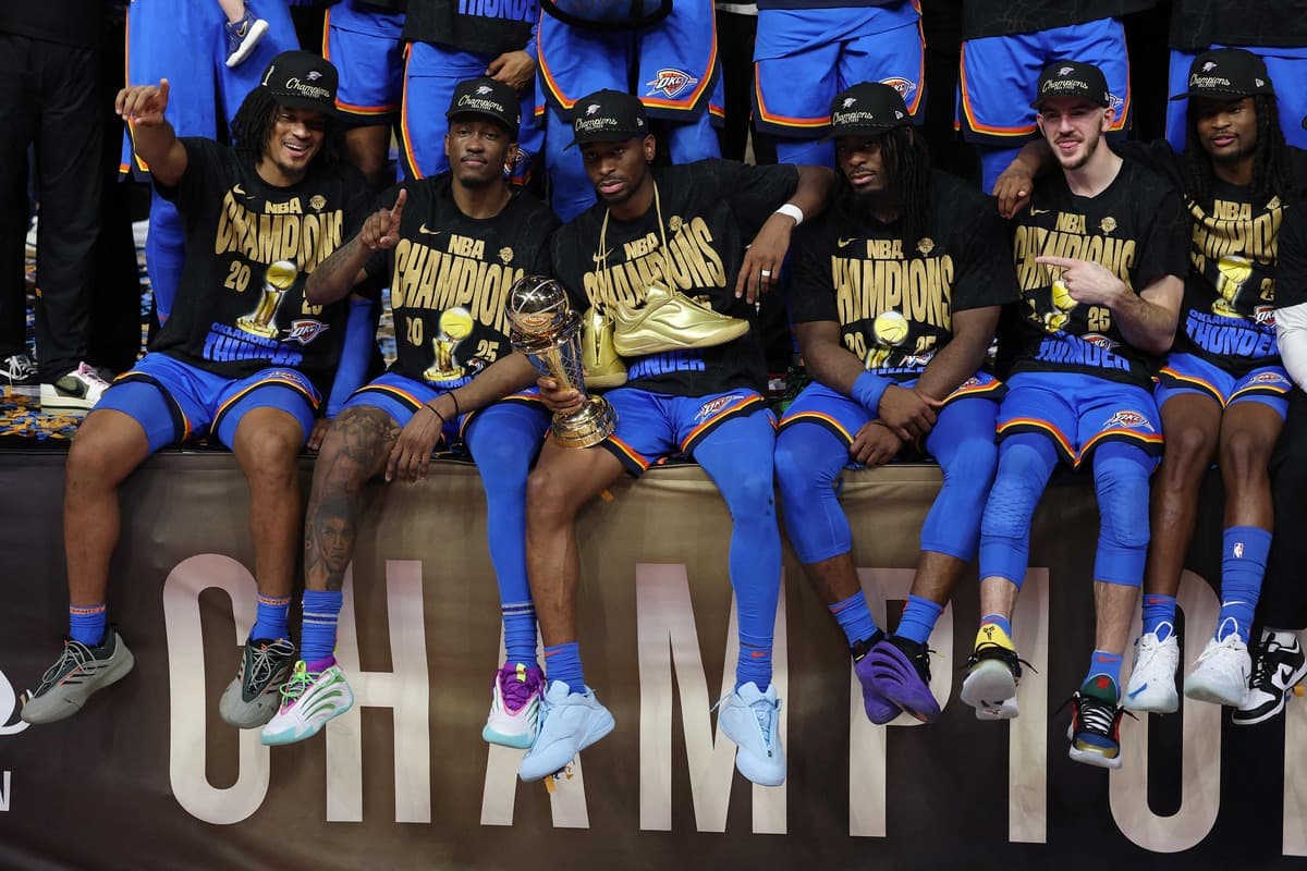 Luguentz Dort celebrates with the NBA Championship trophy