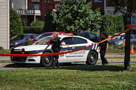 A car drives over a residential median in Brossard, Quebec, Canada. June 30, 2024 is Sunday. In this photo: Longueville police at the scene. Mario Beauregard/Agence QMI