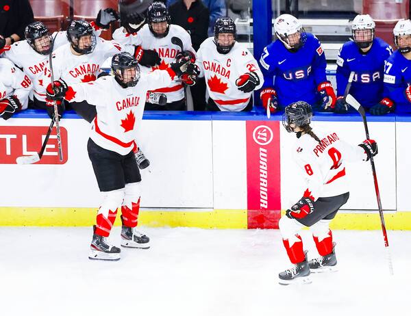 Chloe Primerano with the Canadian flag