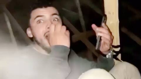 One of the tenants of the house hid from the police in the attic.