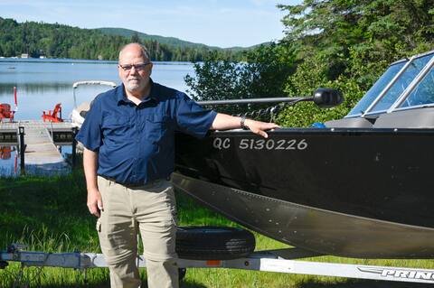 Stephen Portua, president of the Sports Fishermen's Association of Quebec, in front of Lake Manito.