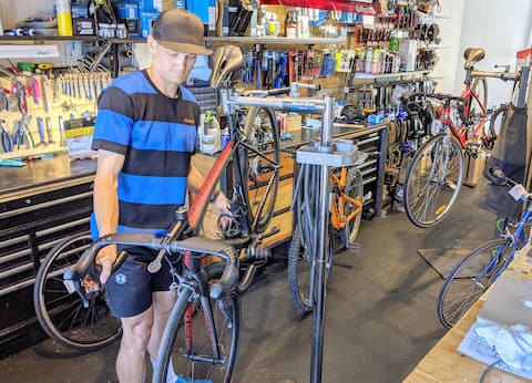 The athlete at his job at Joe Bicycles in St. George, Bos.