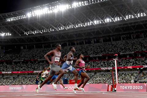 Aaron Brown of Canada overtook Liberian Joseph Fonbulleh (center) and American Noah Liles (right) in his 200m semi-final wave on Tuesday.