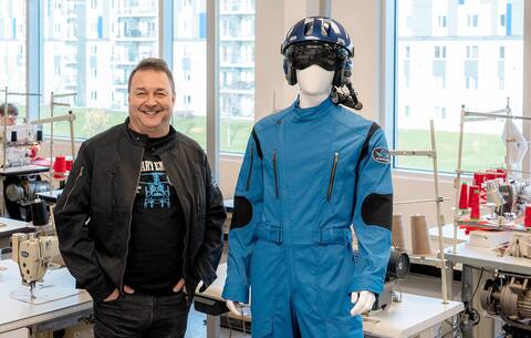 Entrepreneur Stéphan Huot proudly poses alongside a pilot suit created by one of his companies, STEPHAN/H. The founder of Amazon, Jeff Bezos, as well as NASA have notably acquired these clothes.