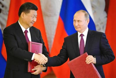 President Vladimir Putin and his Chinese counterpart Xi Jinping shake hands during a meeting in Moscow in 2017.