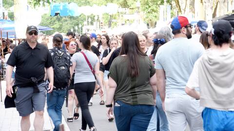 Festival goers take advantage of the pedestrian streets.