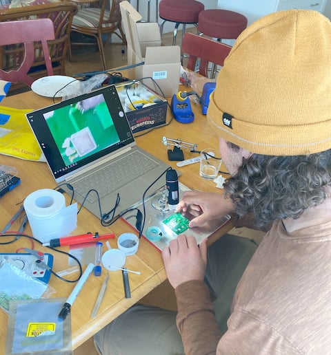 An employee working on the design and manufacture of printed circuit boards for the company's scanner, Samuel Doyan.