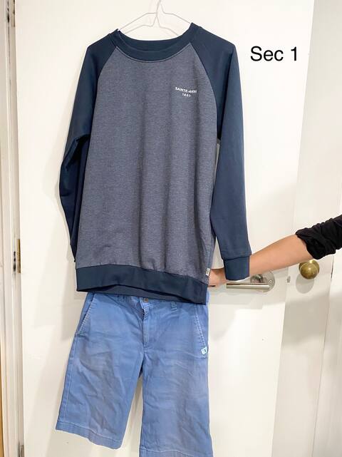 A student's mother displays the shorts her daughter will be wearing this year.