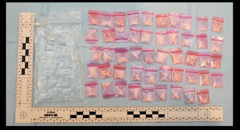 Police seized several small pink translucent plastic bags during the investigation.