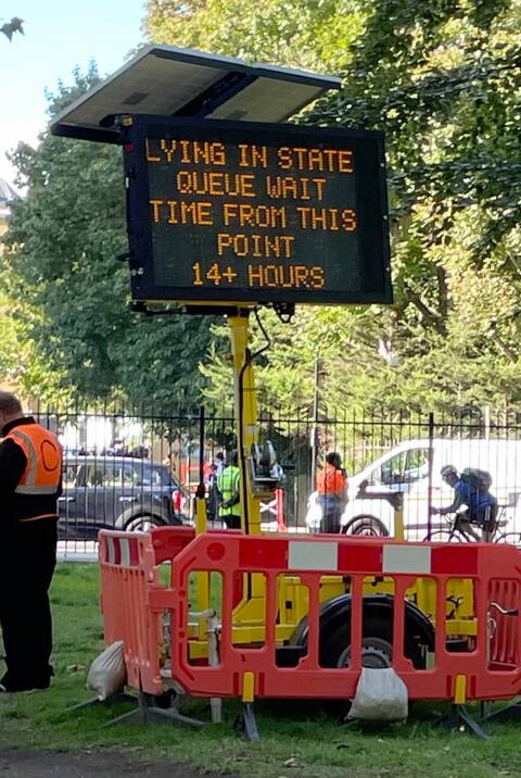A sign warned citizens that the wait time was more than 14 hours.