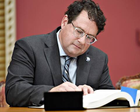 Bernard Drainville during his swearing in as minister last week. He will soon meet with the Ethics Commissioner and must obey her orders.