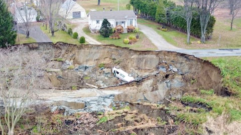 We see a white van that has come into the hole. The driver escaped unhurt.