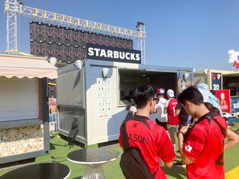 Soccer fans who live in these villages find different businesses for their needs, even a Starbucks coffee kiosk