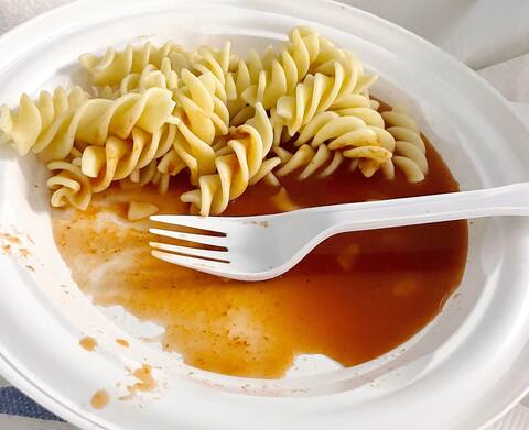 Another meal, this time with pasta in a liquid sauce background.