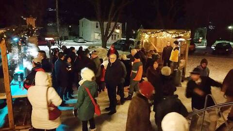 For 10 years, midnight mass in Racine has begun with a festival of lights, when mulled wine is served outside the church.
