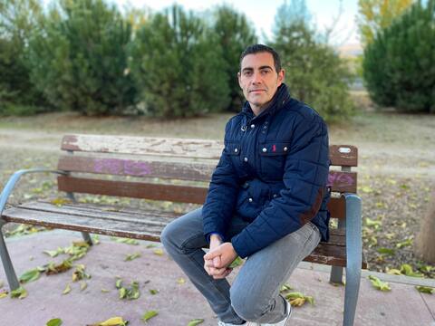 Francisco Javier Orantes sits on a bench in Ana Orantes Park, Granada, Spain.