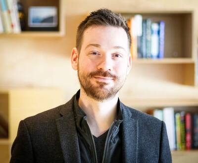 MRI of head of elderly woman in hands of doctor standing in medical ward near senior patient with relative and nurse. Recovery following a stroke