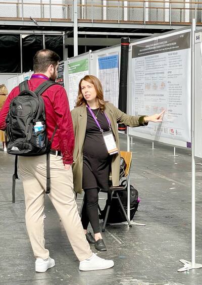 MRI of head of elderly woman in hands of doctor standing in medical ward near senior patient with relative and nurse. Recovery following a stroke
