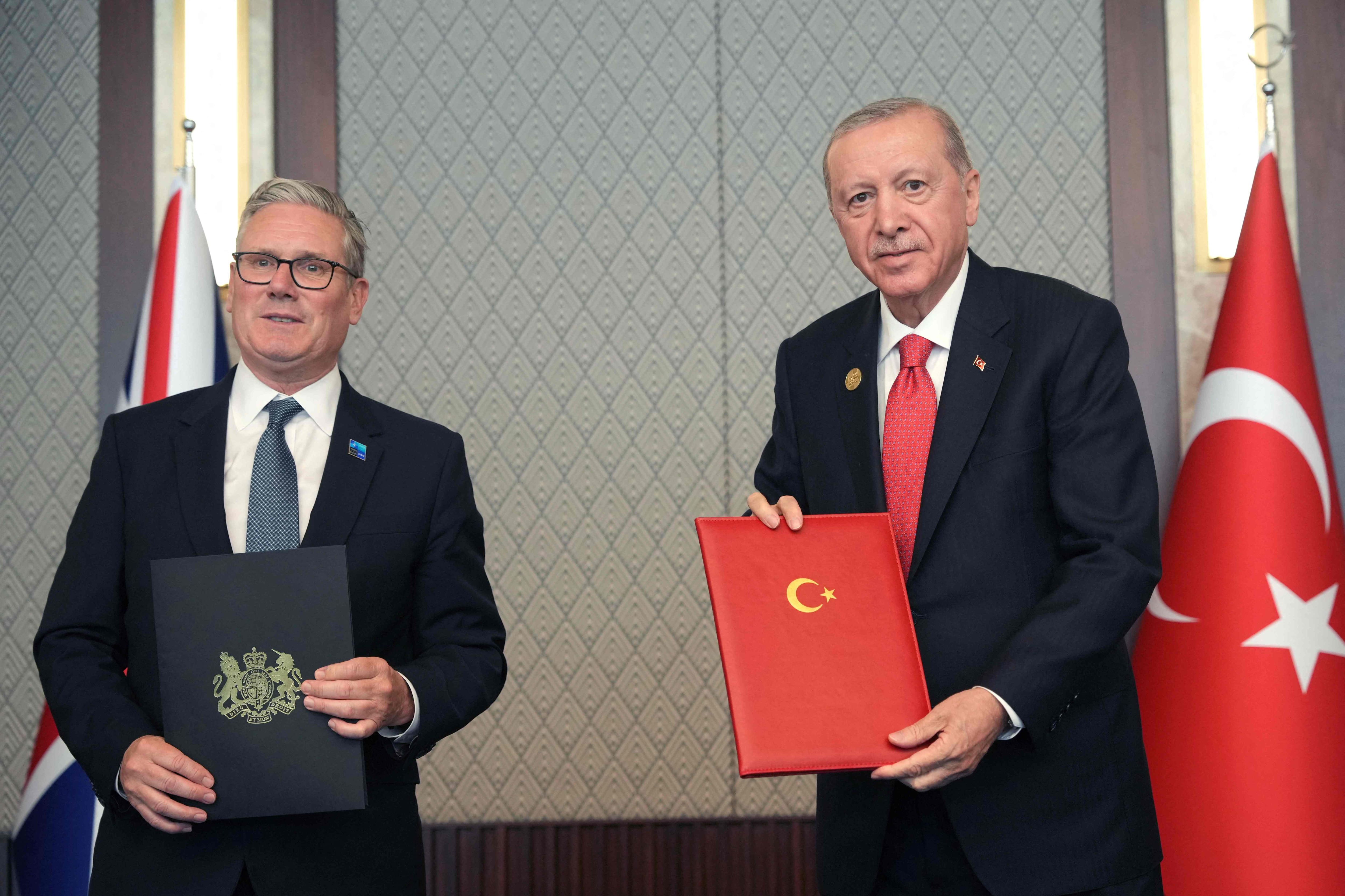 Turkish President Gifts Gun to Leaders at NATO Summit