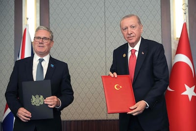 British Prime Minister Keir Starmer (left) and Turkish President Recep Tayyip Erdogan sign a defense partnership agreement on the sidelines of the NATO Summit at the Bestepe presidential complex in Ankara, July 8, 2026.