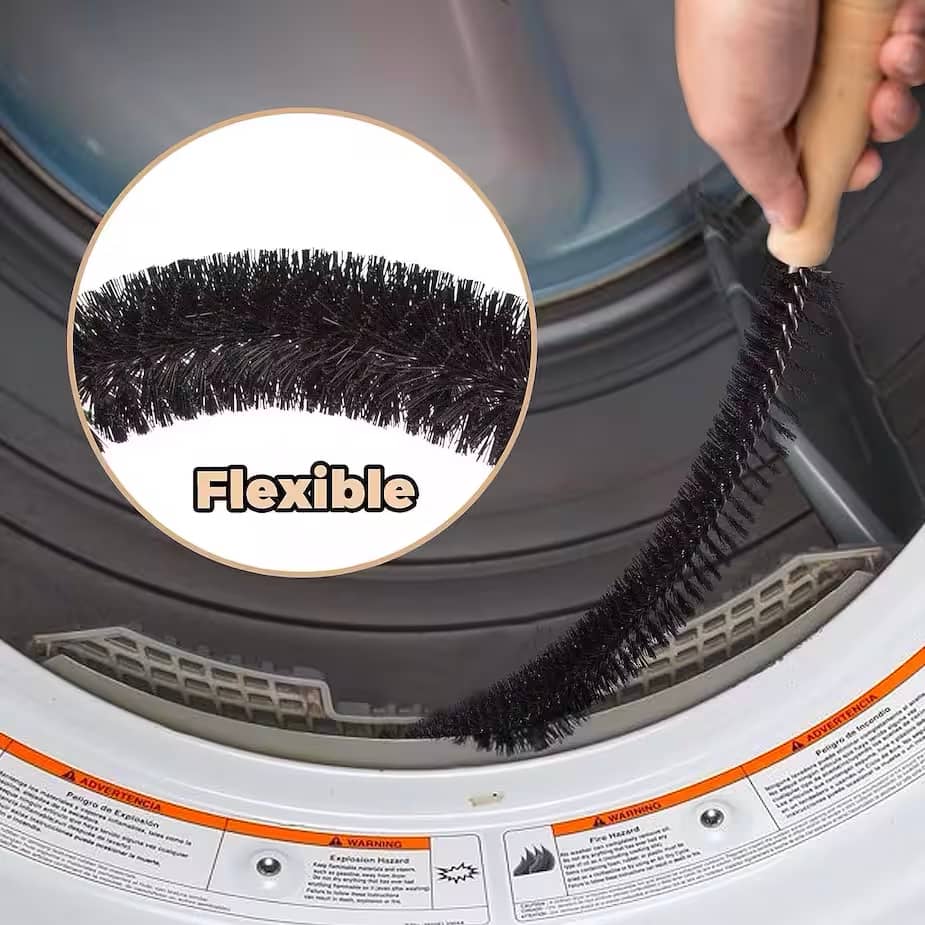 Une brosse pour vider la mousse de la sécheuse