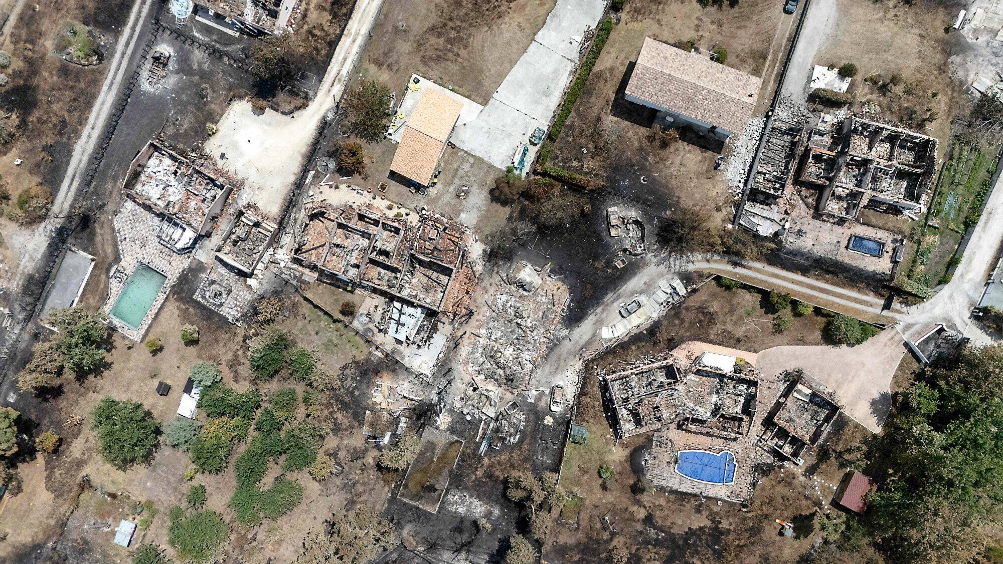 This aerial view shows damaged houses in a burned area in the commune of Porge, following a forest fire in the Gironde department, southwest France, on July 27, 2026.