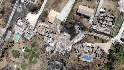 This aerial view shows damaged houses in a burned area in the commune of Porge, following a forest fire in the Gironde department, southwest France, on July 27, 2026.