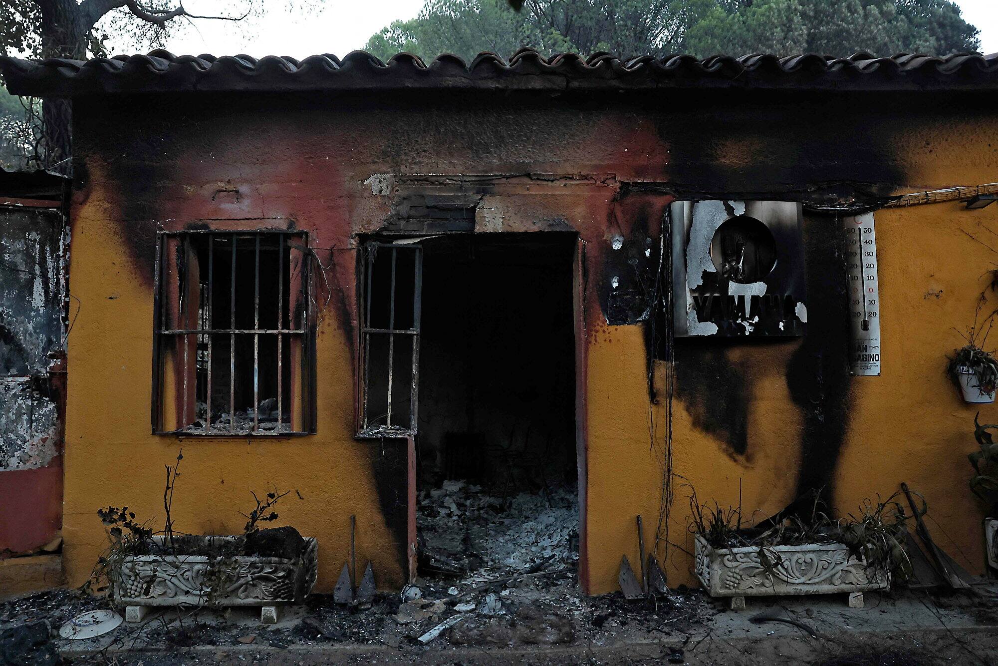 View of the charred marina building near the El Ancla dock on the San Juan reservoir, following a forest fire in Pelayos de la Presa (community of Madrid, Spain), July 27, 2026.