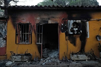 View of the charred marina building near the El Ancla dock on the San Juan reservoir, following a forest fire in Pelayos de la Presa (community of Madrid, Spain), July 27, 2026.