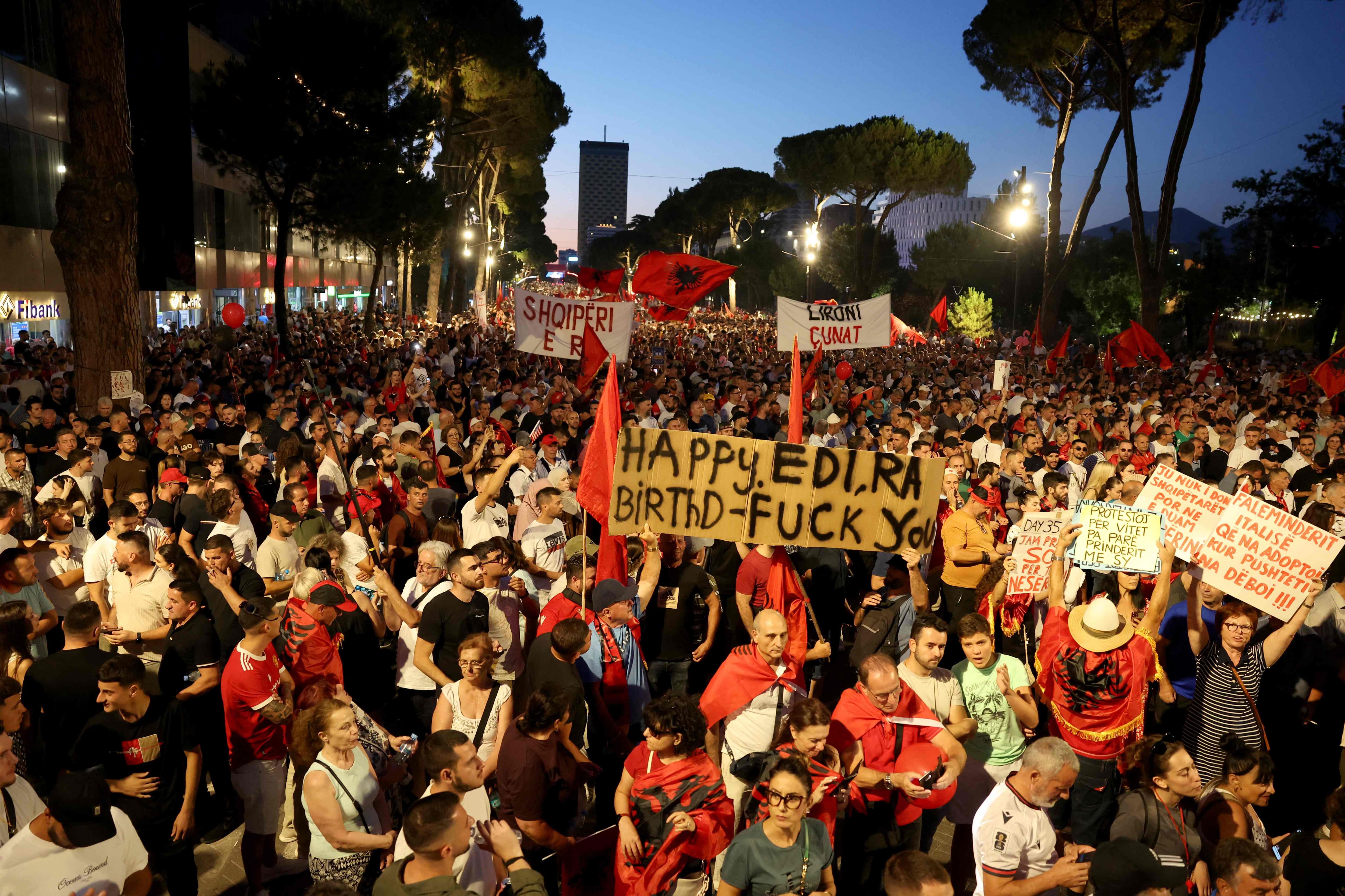Demonstrators gather in front of the Albanian Prime Minister's office to protest against the construction of a luxury resort near a protected natural area on Albania's southern coast, in Tirana, July 4, 2026.